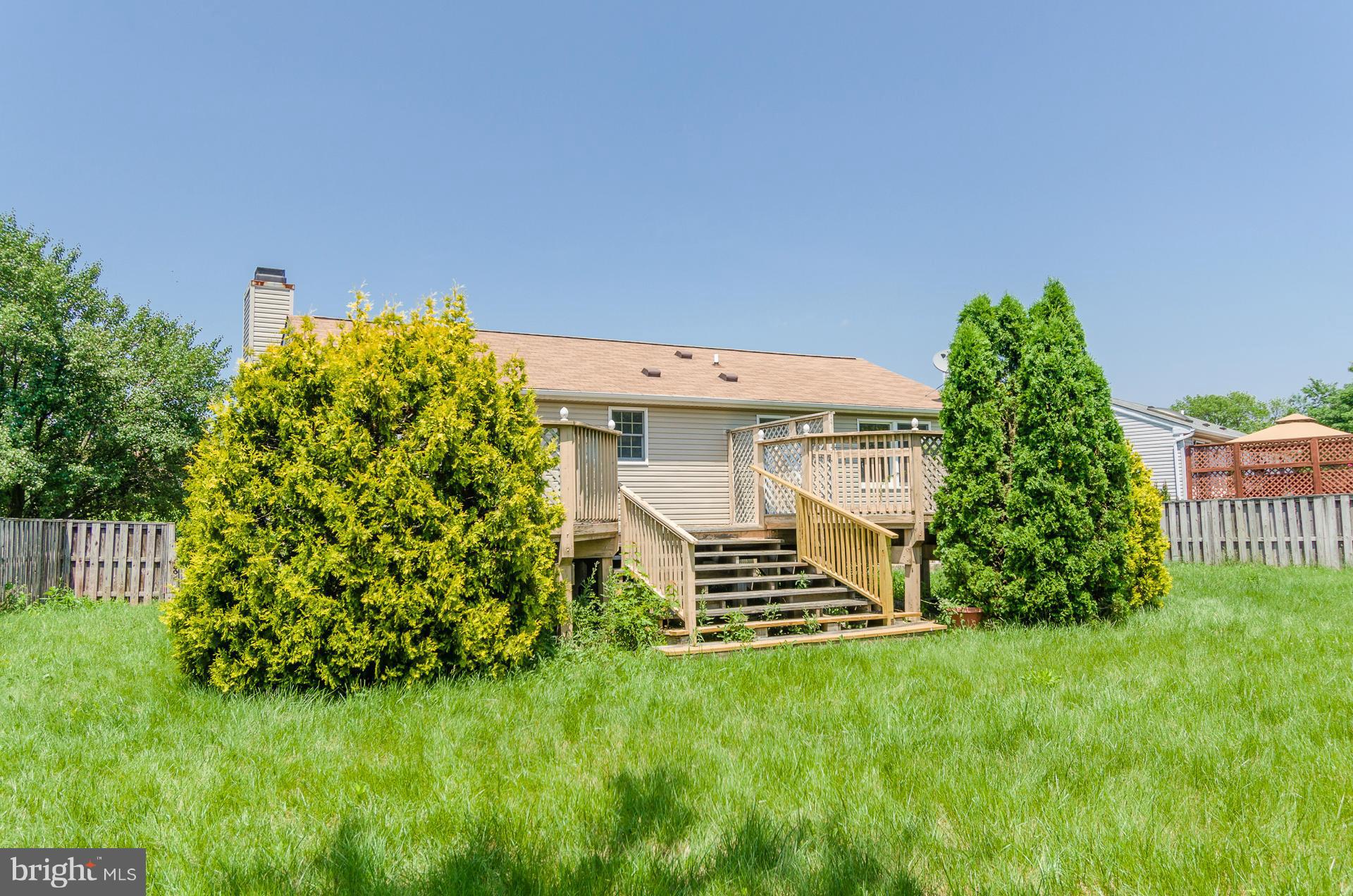 3123 Ripple Road Baltimore, MD 21244 - Photo 24 of 29 a front view of a house with a garden