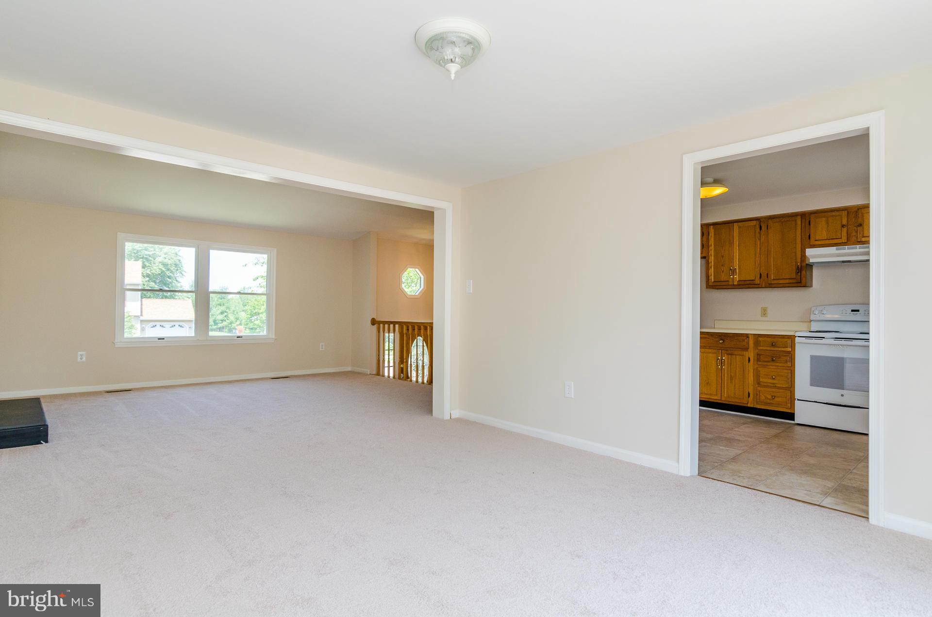 3123 Ripple Road Baltimore, MD 21244 - Photo 4 of 29 a view of a kitchen and a sink dishwasher and a fireplace