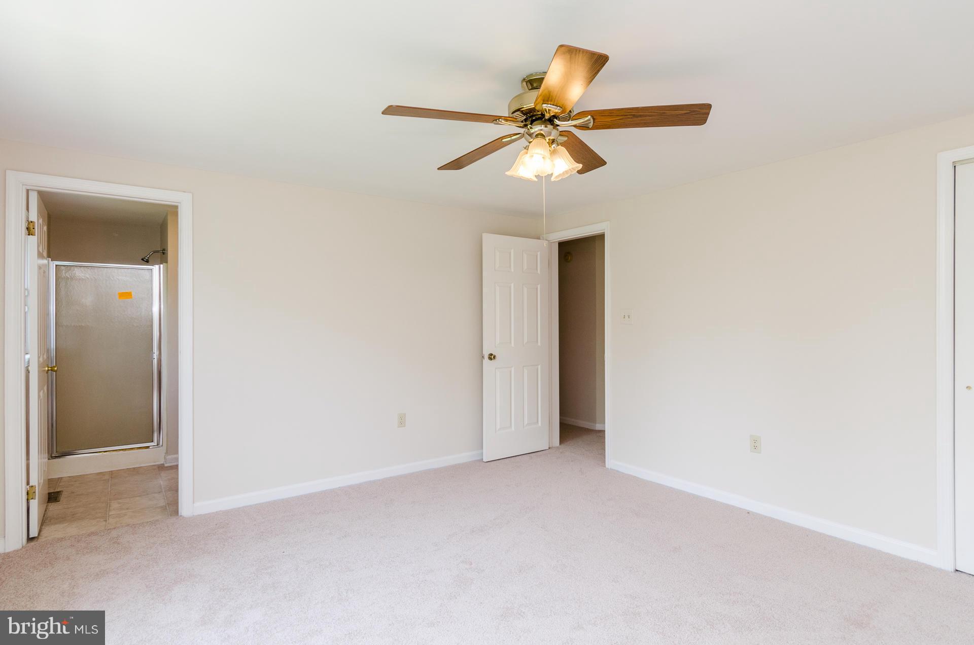 3123 Ripple Road Baltimore, MD 21244 - Photo 8 of 29 an empty room with a fan and a fan