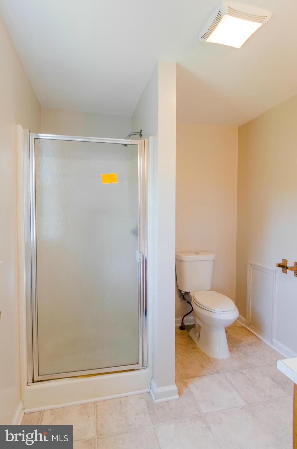 3123 Ripple Road Baltimore, MD 21244 - Photo 9 of 29 a bathroom with a toilet and a shower