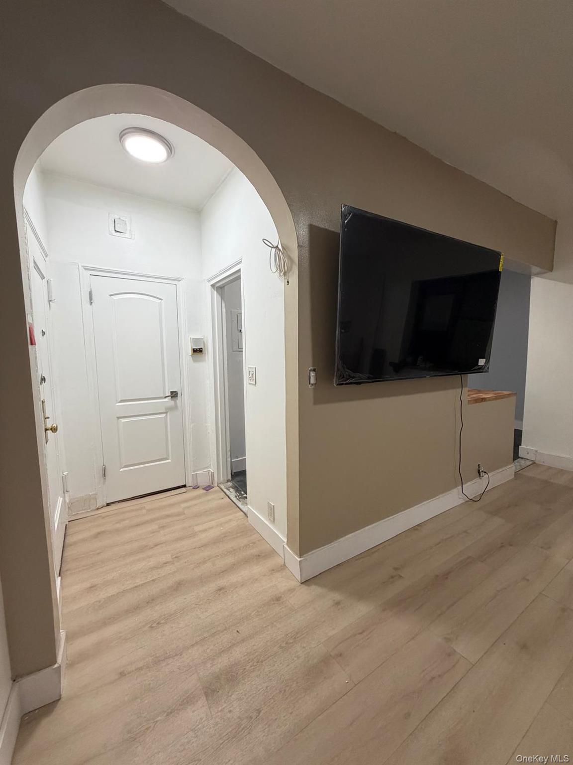 110 Stonelea Place, Unit 4A New Rochelle, NY 10801 - Photo 5 of 8 a view of livingroom with a flat screen tv