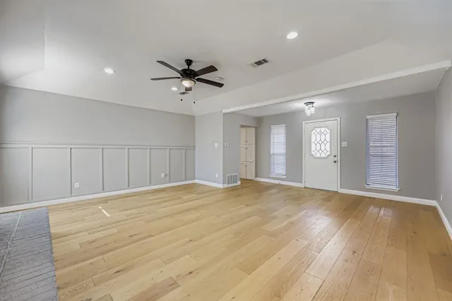 a view of an empty room with a window