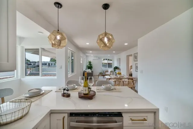 a bathroom with a sink vanity and a mirror