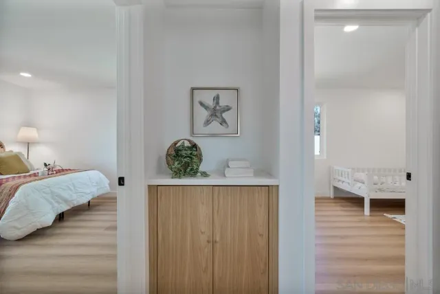 a bathroom with a toilet a sink and a mirror
