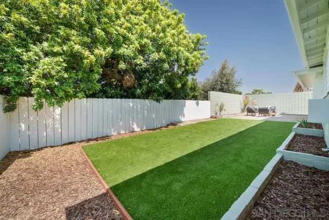 a view of a building with outdoor space and seating area