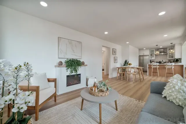 a living room with furniture and a table