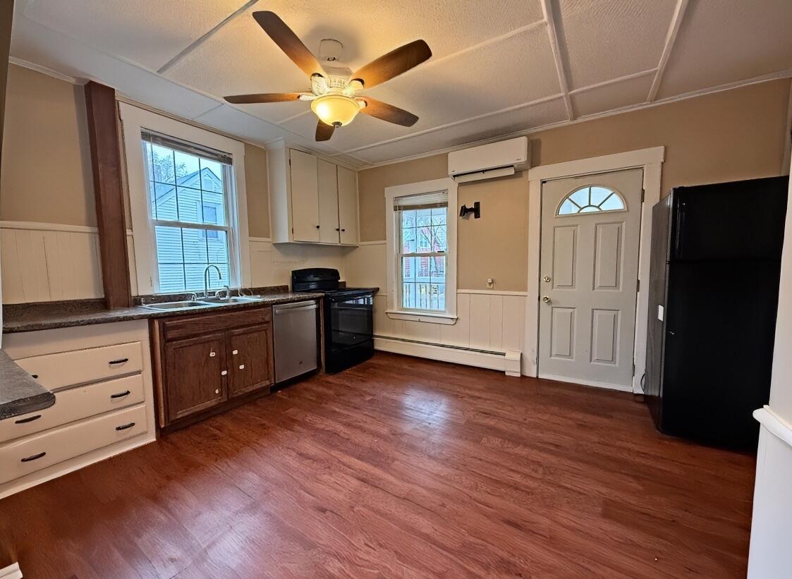 7 Squire Street Waterville, ME 04901 - Photo 10 of 40 10. Kitchen Door & Heat Pump