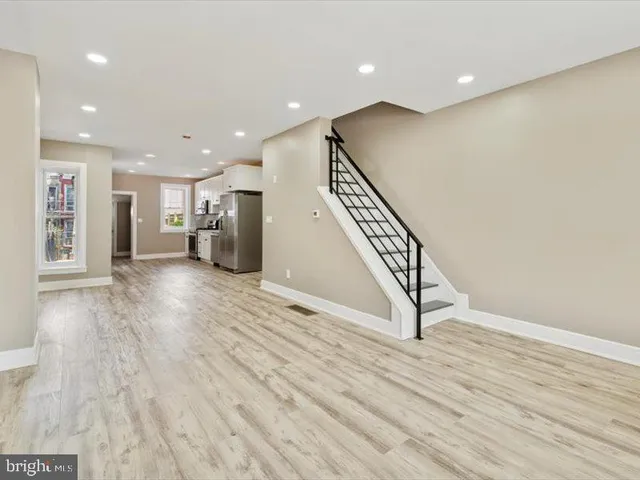 a view of an entryway with wooden floor