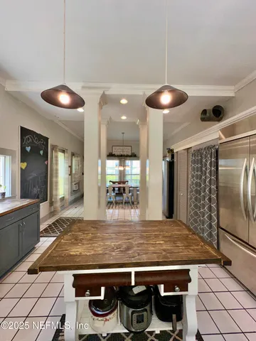 a kitchen with stainless steel appliances granite countertop a stove and a refrigerator