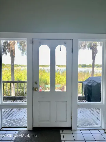 a view of front door and bedroom
