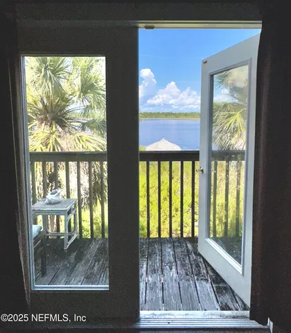 a view of a floor to ceiling window and a living room
