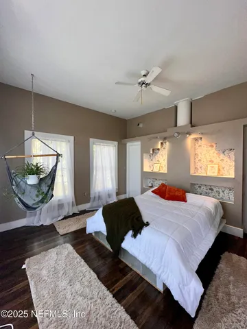 a bedroom with a bed and window