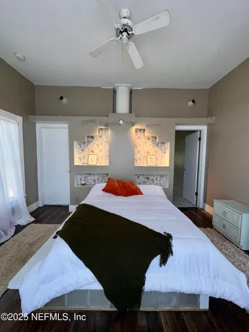 a bathroom with a glass shower door and mirror