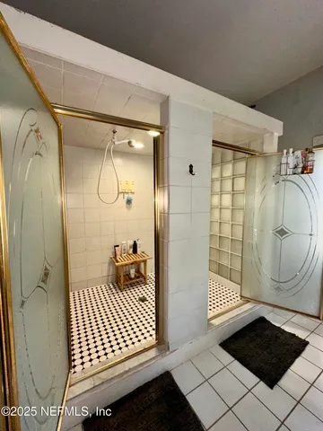 a large kitchen with granite countertop a stove a sink dishwasher and a refrigerator