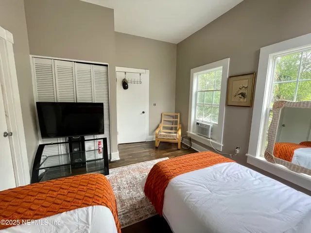 a bathroom with a sink mirror and shower