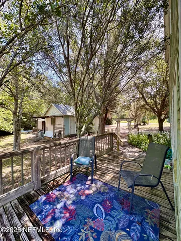 a view of a porch with wooden floor
