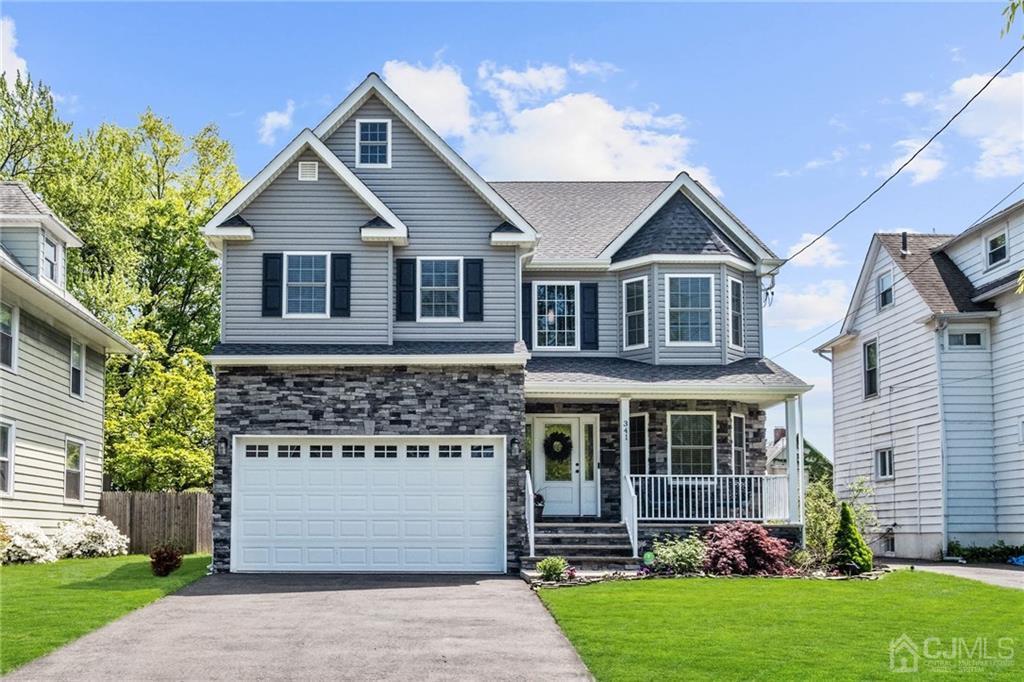 341 Dunellen Avenue Dunellen, NJ 08812 - Photo 1 of 24 a front view of a house with a yard