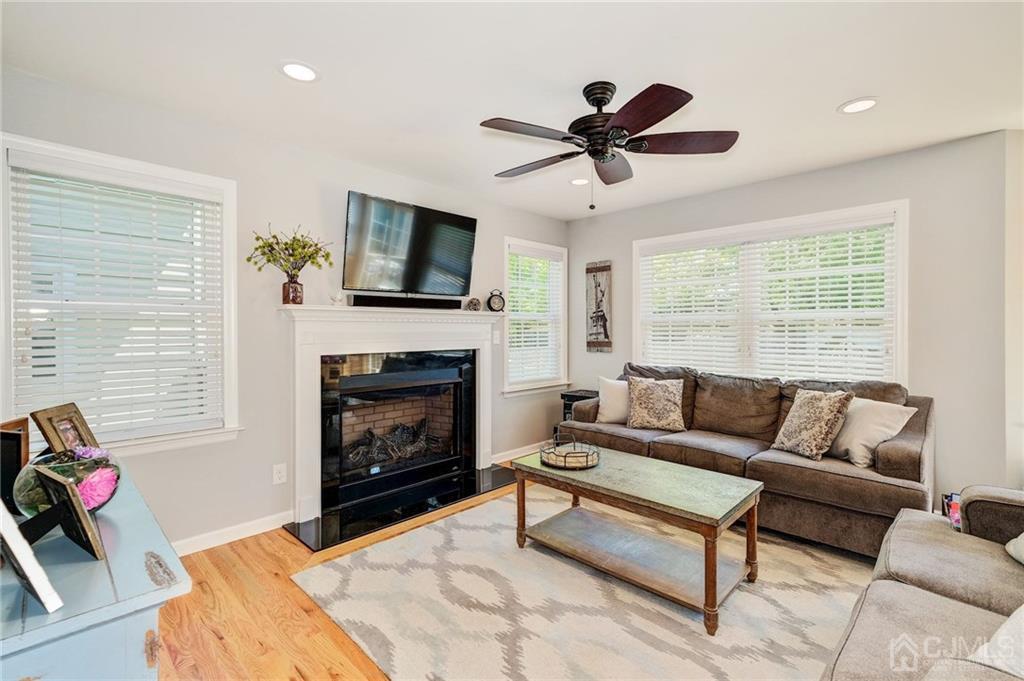 341 Dunellen Avenue Dunellen, NJ 08812 - Photo 12 of 24 a living room with furniture a flat screen tv and a fireplace