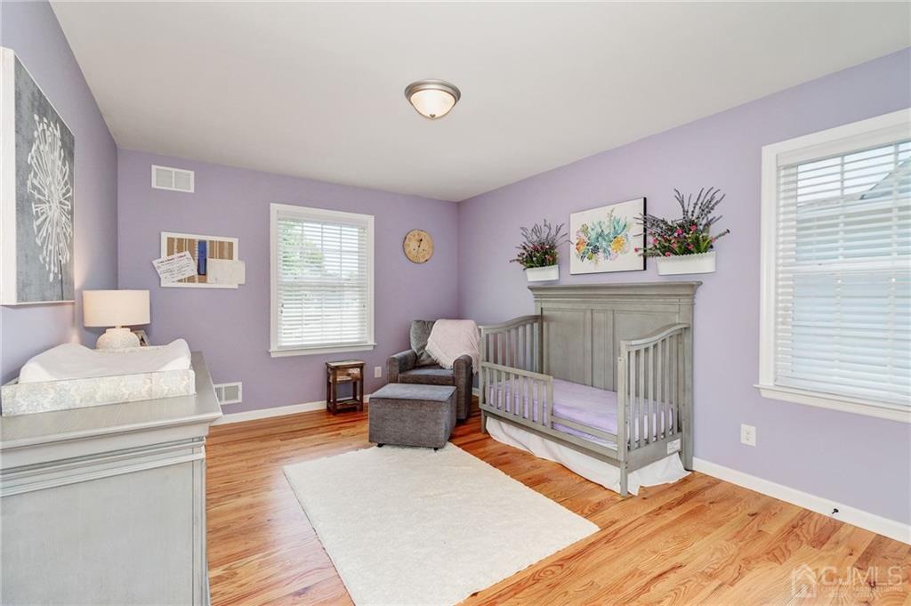 341 Dunellen Avenue Dunellen, NJ 08812 - Photo 18 of 24 a bedroom with furniture and a window