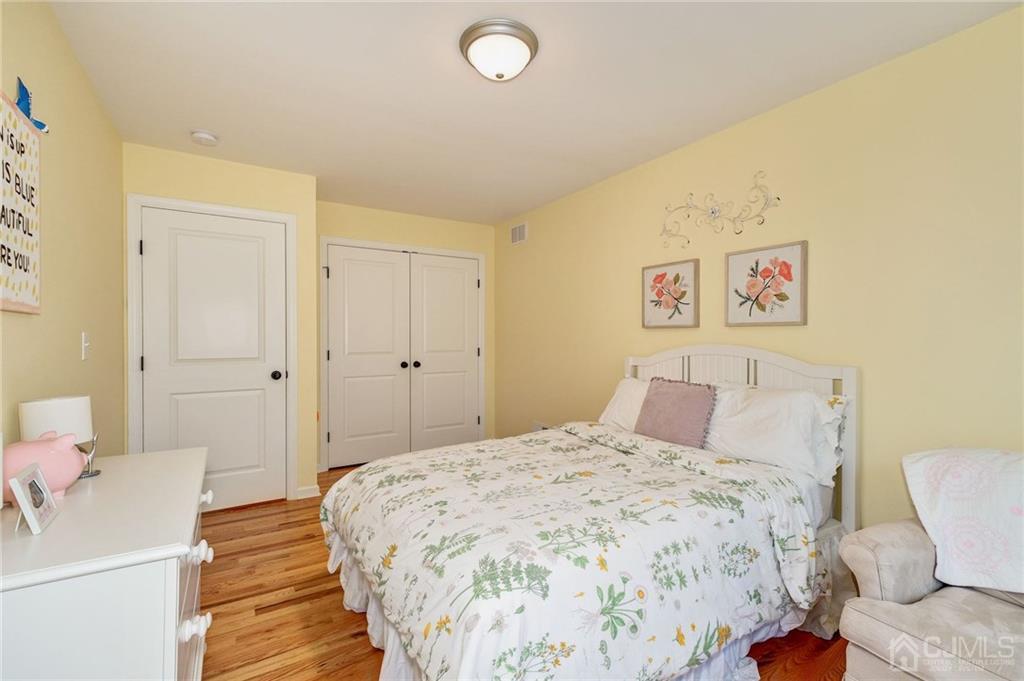 341 Dunellen Avenue Dunellen, NJ 08812 - Photo 19 of 24 a bedroom with a bed and a couch