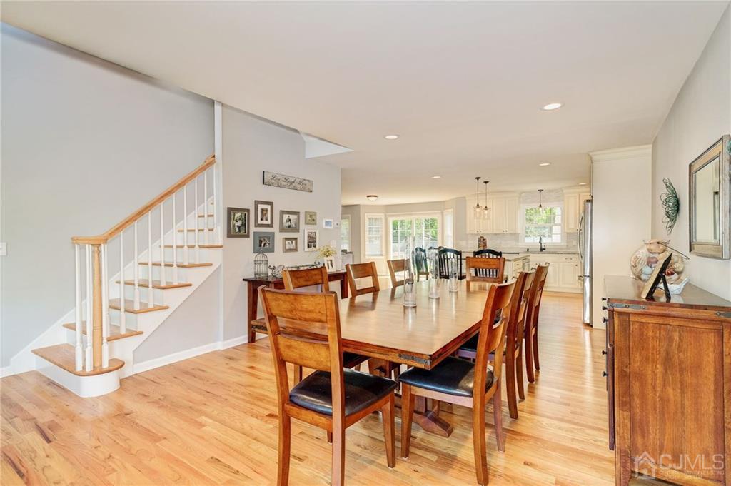 341 Dunellen Avenue Dunellen, NJ 08812 - Photo 2 of 24 a view of a dining room and livingroom with furniture wooden floor and a rug