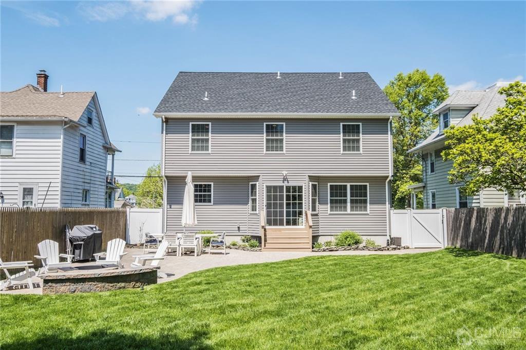 341 Dunellen Avenue Dunellen, NJ 08812 - Photo 23 of 24 a front view of house with a garden and patio