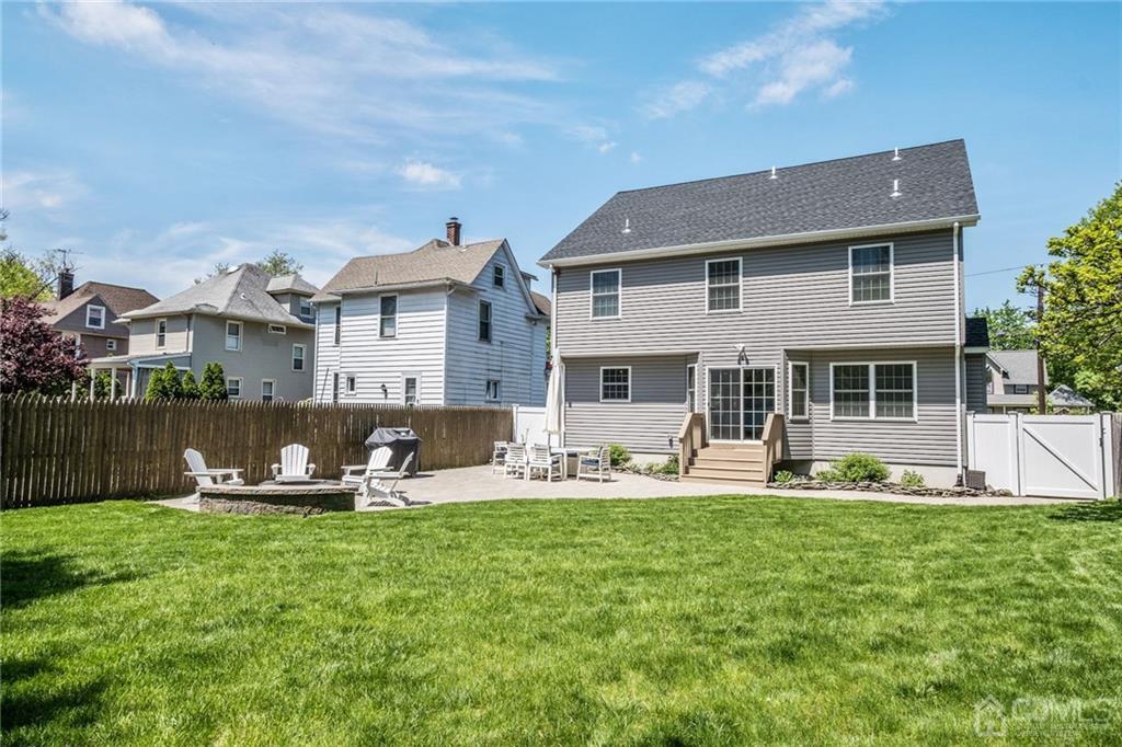 341 Dunellen Avenue Dunellen, NJ 08812 - Photo 24 of 24 a front view of house with yard and seating area