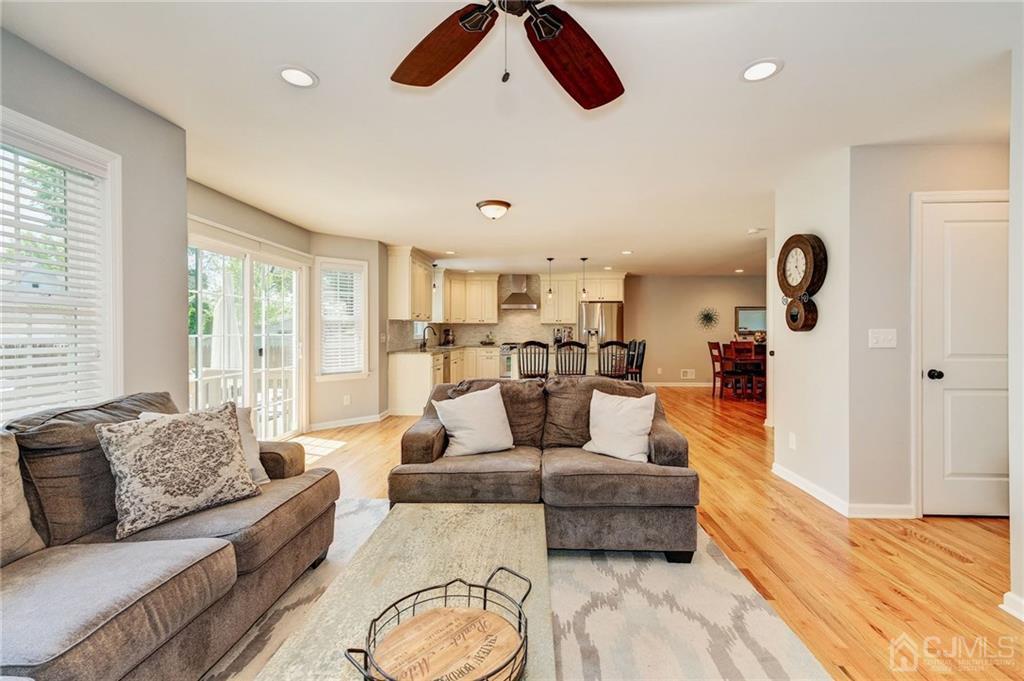 341 Dunellen Avenue Dunellen, NJ 08812 - Photo 9 of 24 a living room with furniture kitchen view and large windows