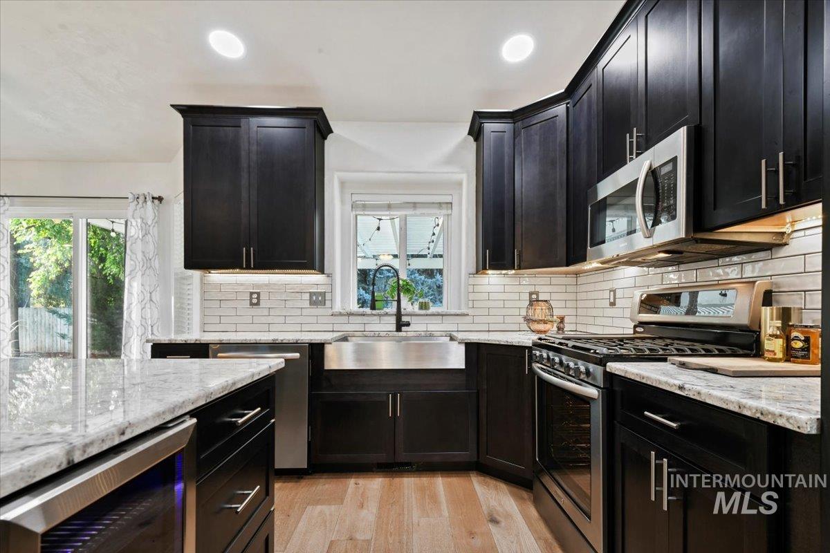 12019 West Rader Drive Boise, ID 83713 - Photo 12 of 41 Stainless steel appliances and undermount sink looking over the backyard