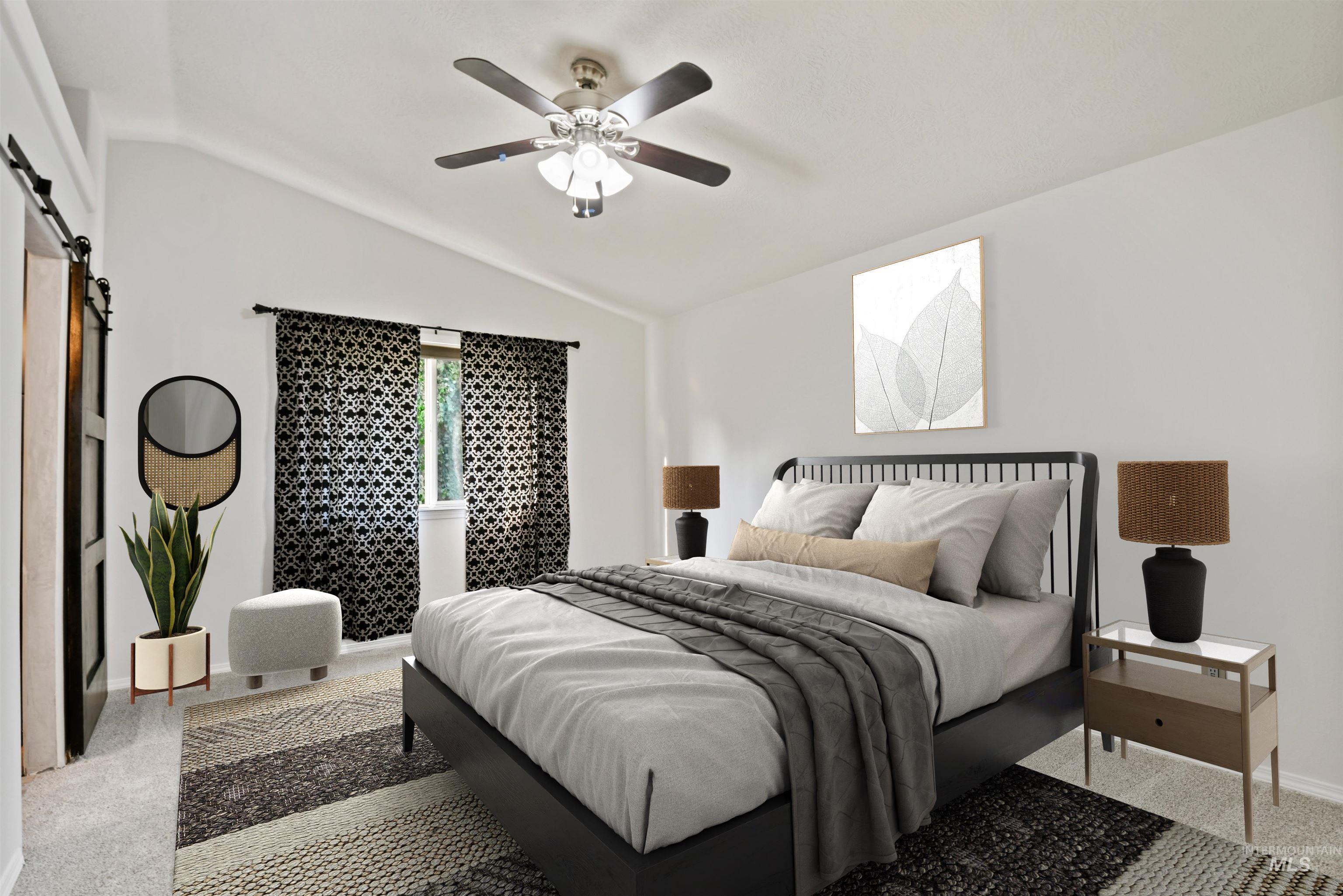 12019 West Rader Drive Boise, ID 83713 - Photo 18 of 41 Carpeted bedroom with a barn door, lofted ceiling, and fan