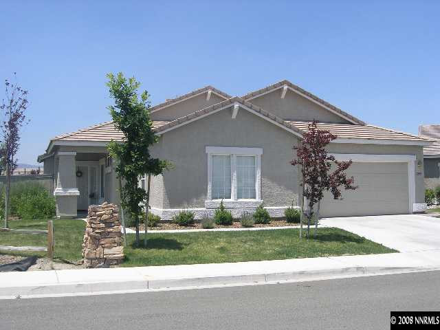 1895 Jamboree Drive Reno, NV 89521 - Photo 1 of 5 a front view of a house with garden