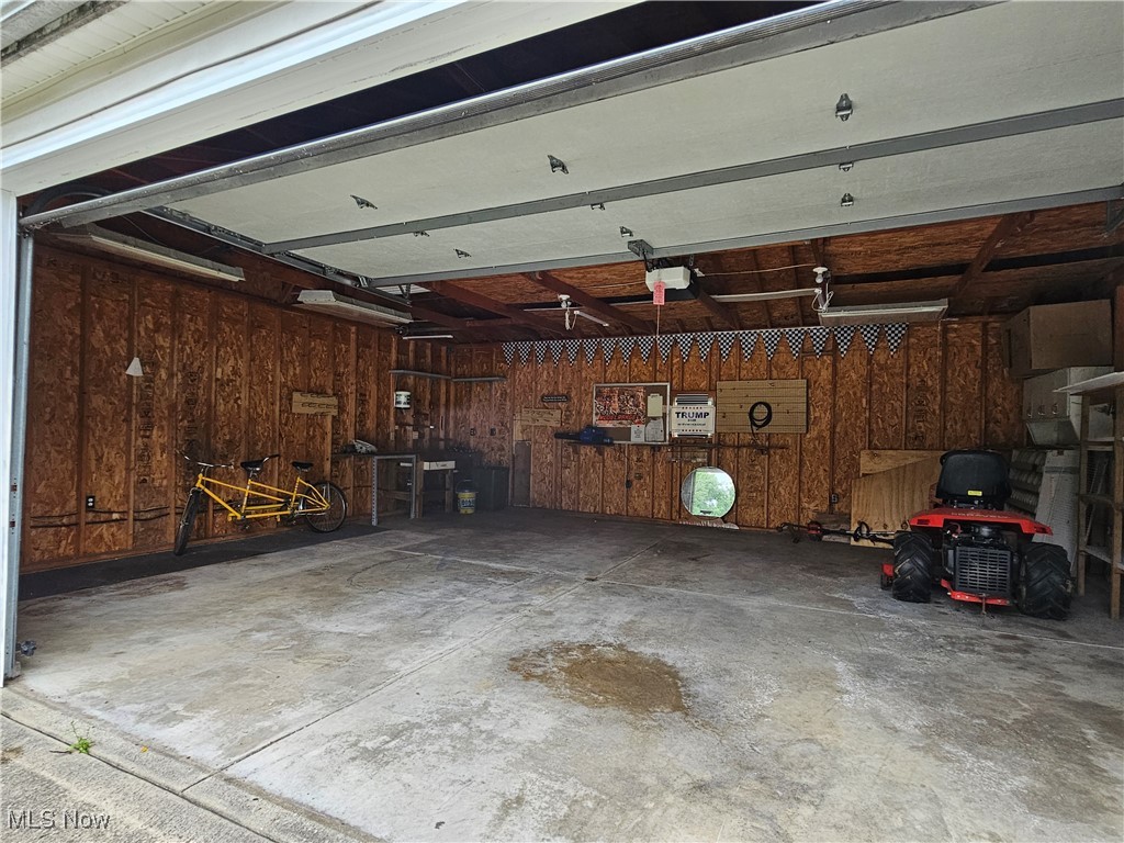 5847 Struthers Road Lowellville, OH 44436 - Photo 23 of 26 Garage featuring a garage door opener