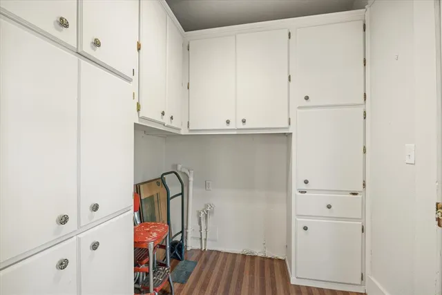a view of an entryway with wooden floor