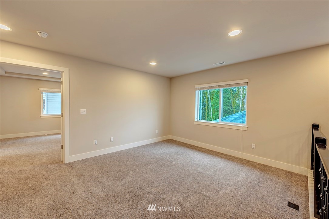 4204 223rd Place Southeast Bothell, WA 98021 - Photo 13 of 23 an empty room with windows