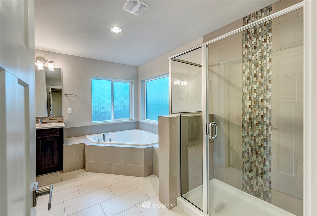 4204 223rd Place Southeast Bothell, WA 98021 - Photo 15 of 23 a bathroom with a large tub shower and sink