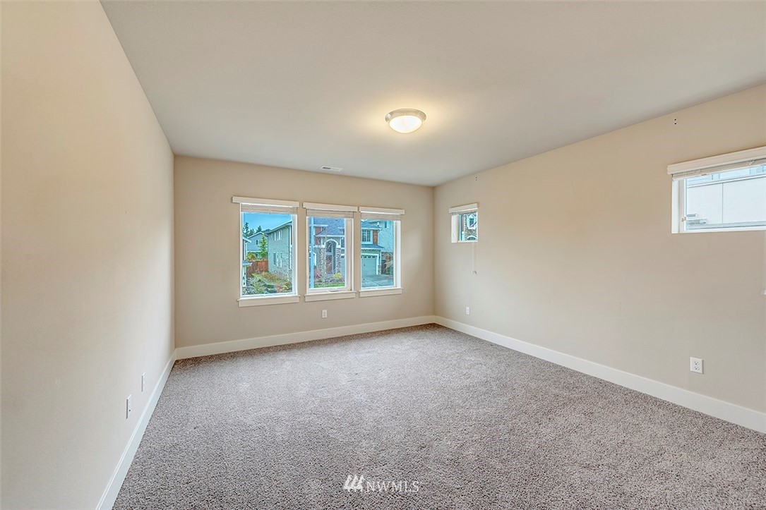 4204 223rd Place Southeast Bothell, WA 98021 - Photo 18 of 23 an empty room with windows