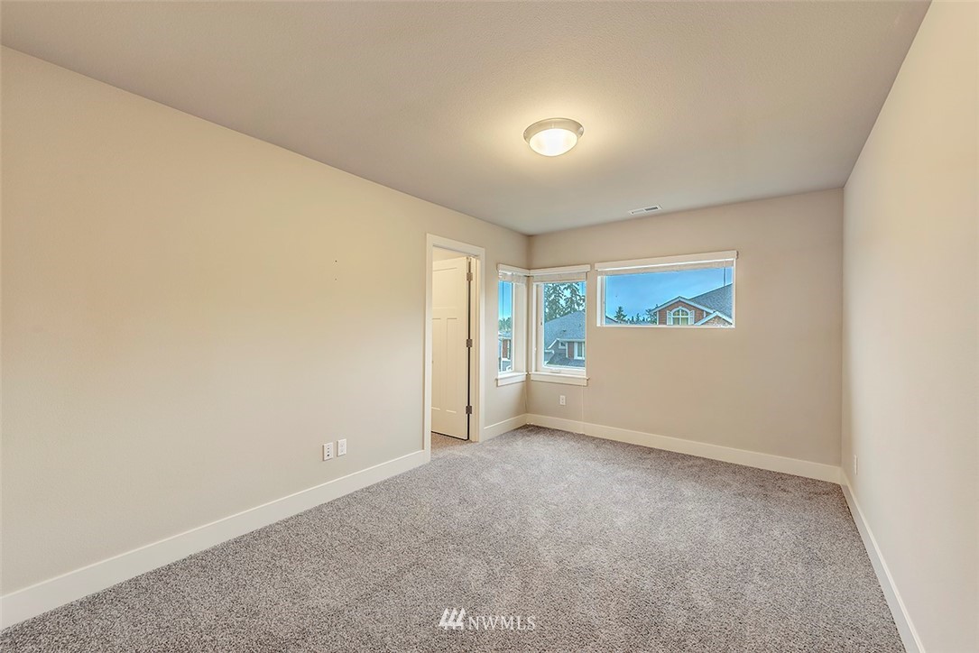 4204 223rd Place Southeast Bothell, WA 98021 - Photo 19 of 23 an empty room with a empty space and windows