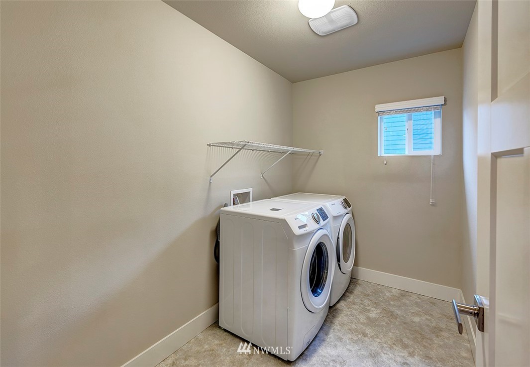 4204 223rd Place Southeast Bothell, WA 98021 - Photo 21 of 23 a utility room with dryer and washer
