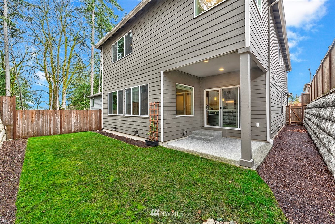 4204 223rd Place Southeast Bothell, WA 98021 - Photo 23 of 23 a view of backyard with wooden fence and a bench