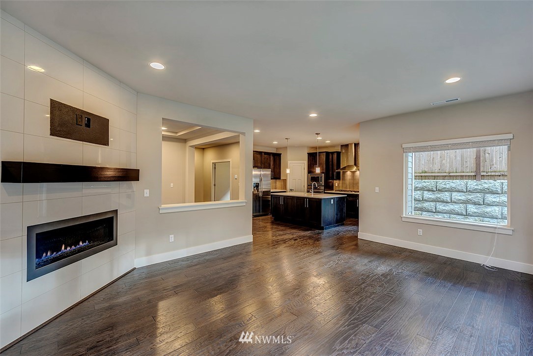 4204 223rd Place Southeast Bothell, WA 98021 - Photo 7 of 23 a view of kitchen with furniture and fireplace