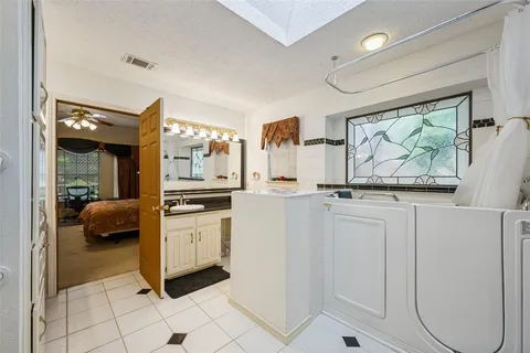 a kitchen with stainless steel appliances kitchen island granite countertop a refrigerator and a stove top oven