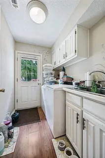 a kitchen with sink cabinets and window