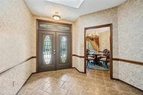 a view of a livingroom with furniture and front door