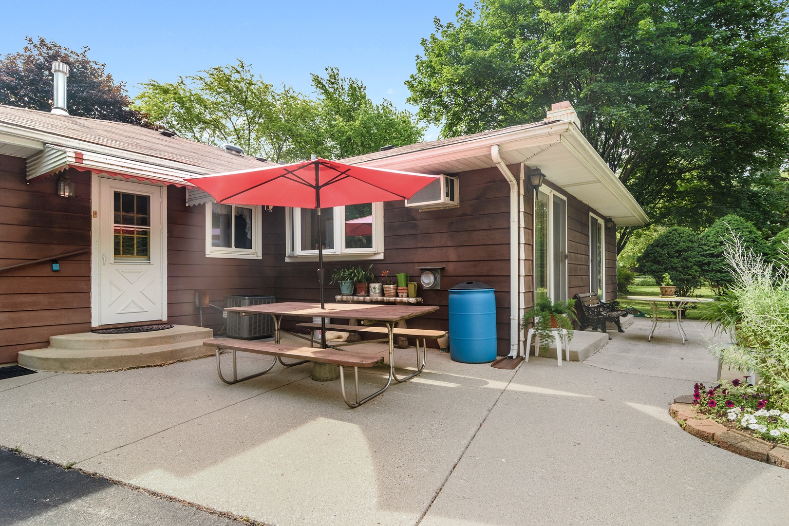 2150 Shermer Road Northbrook, IL 60062 - Photo 17 of 24 a view of a patio with a table and chairs under an umbrella