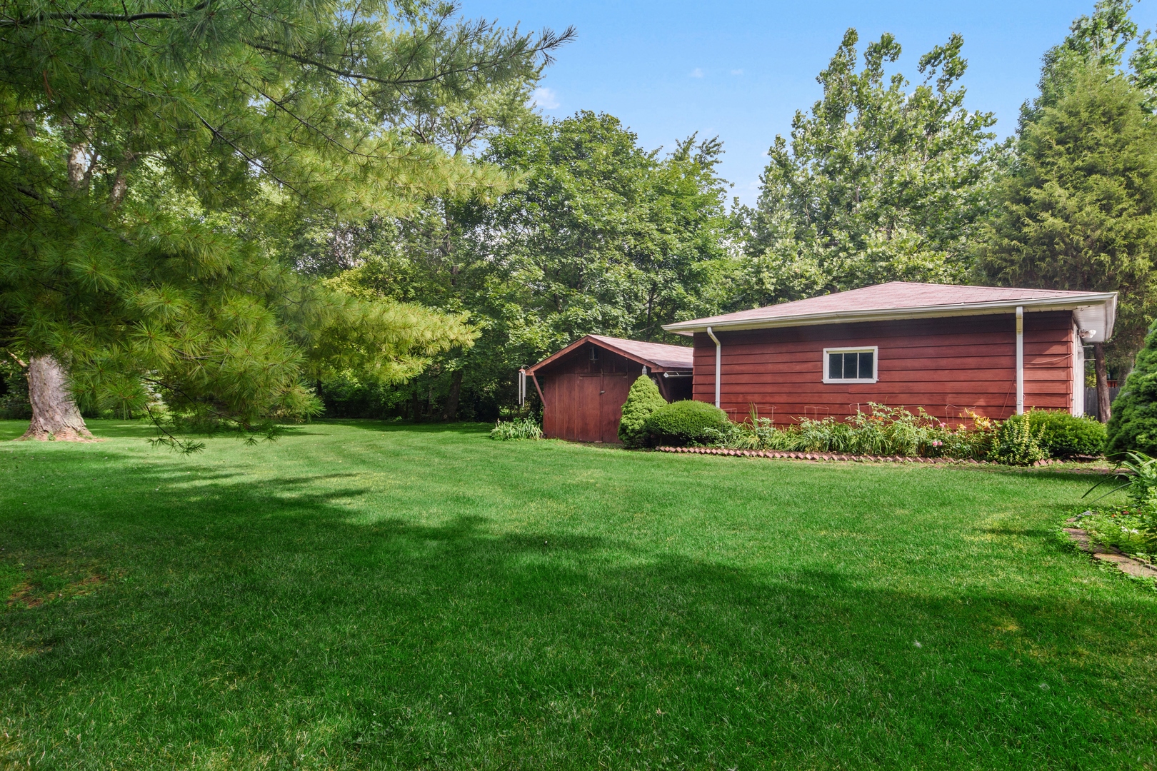 2150 Shermer Road Northbrook, IL 60062 - Photo 20 of 24 a view of a house with a yard and a large tree