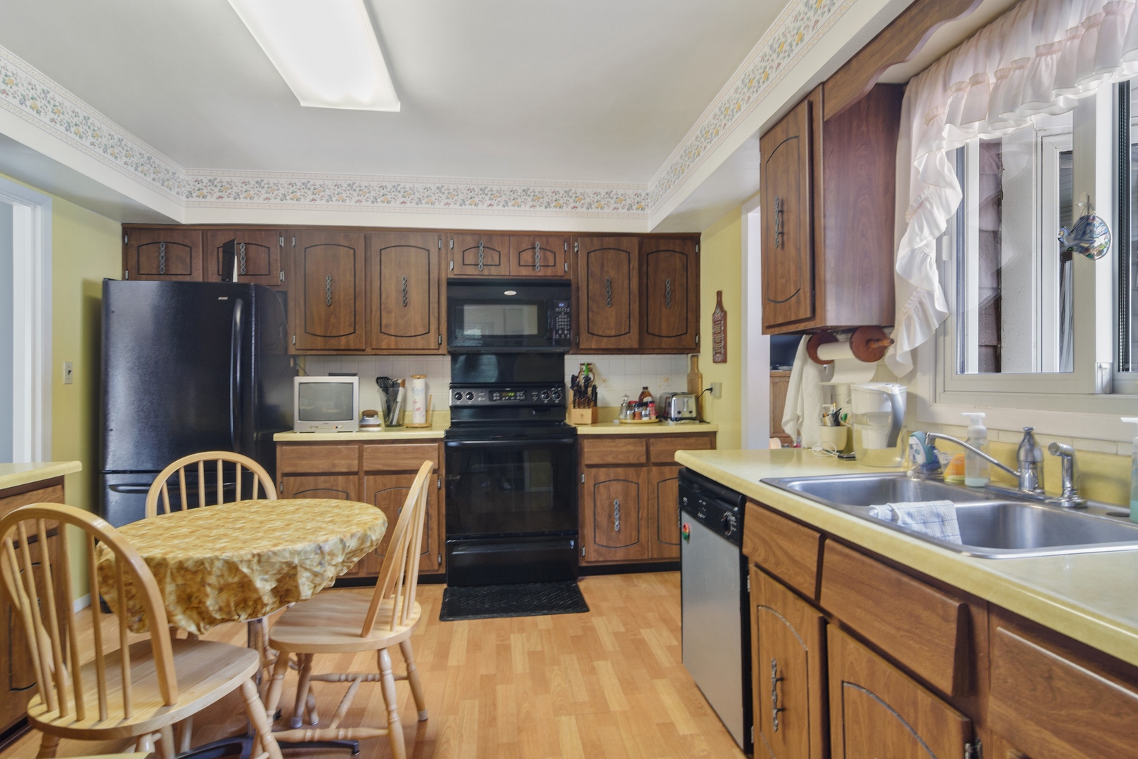2150 Shermer Road Northbrook, IL 60062 - Photo 4 of 24 a kitchen with a sink appliances and cabinets