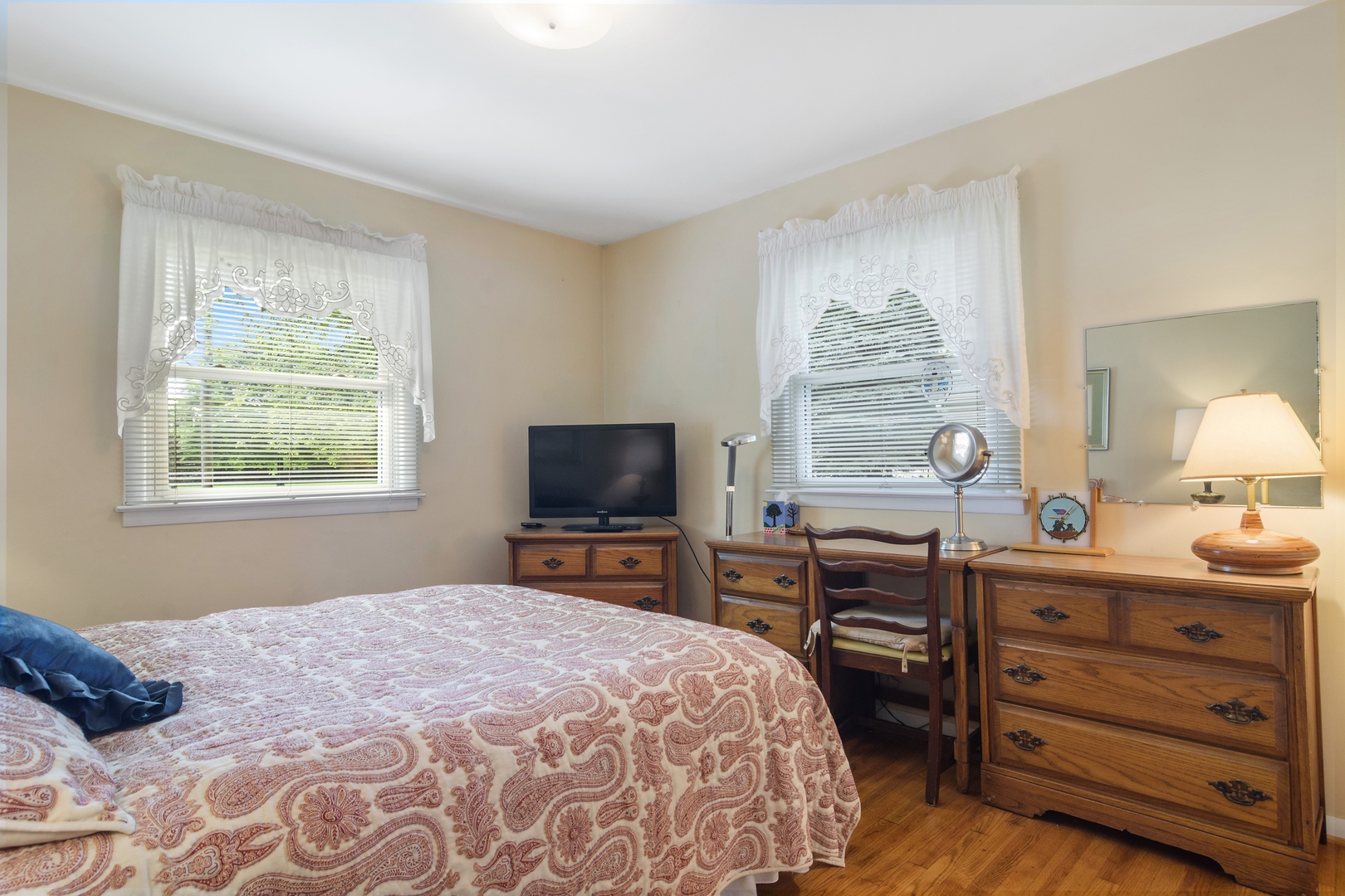 2150 Shermer Road Northbrook, IL 60062 - Photo 10 of 24 a bedroom with a bed and a flat screen tv