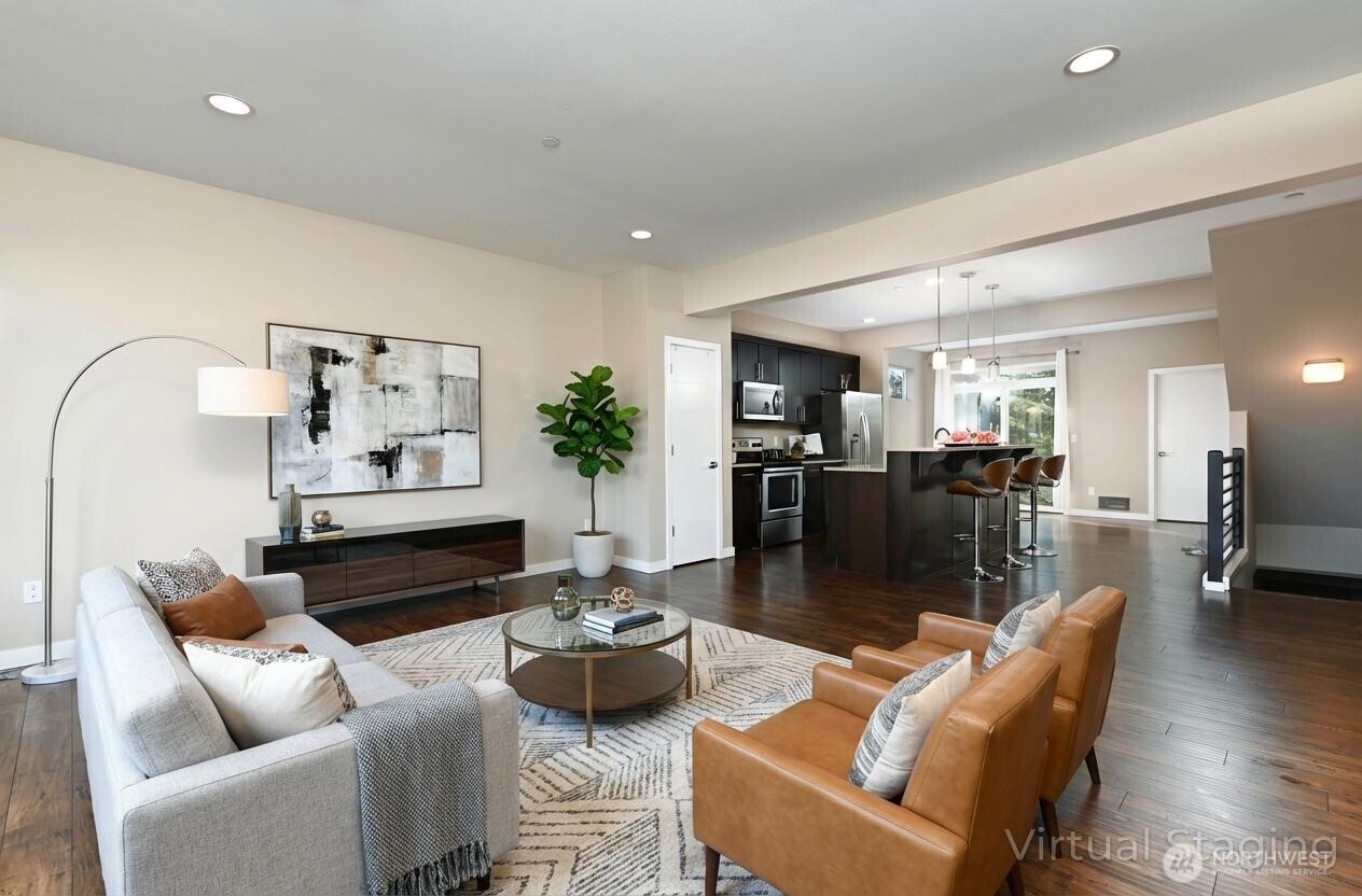 13724 Ash Way, Unit C1 Everett, WA 98204 - Photo 11 of 36 a living room with furniture kitchen view and a wooden floor