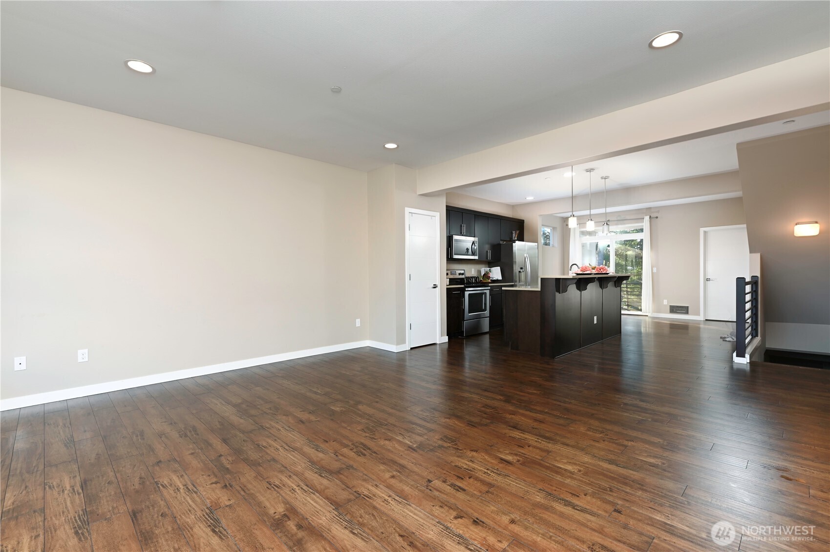 13724 Ash Way, Unit C1 Everett, WA 98204 - Photo 12 of 36 a view of a kitchen with a sink an oven cabinets and wooden floor