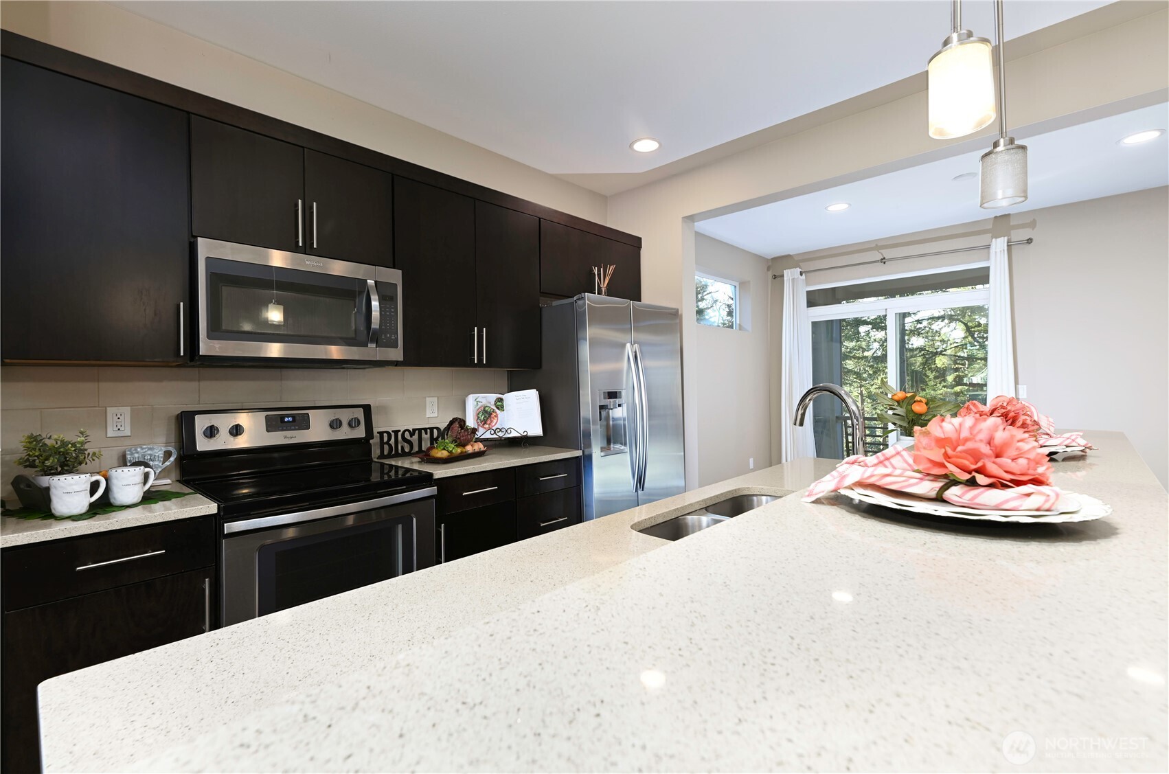 13724 Ash Way, Unit C1 Everett, WA 98204 - Photo 18 of 36 a kitchen with stainless steel appliances a stove microwave and refrigerator